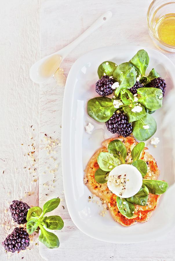 Sesame Seed Cakes With Goats Cream Cheese, Lambs Lettuce And Blackberries Photograph by Birgit Twellmann
