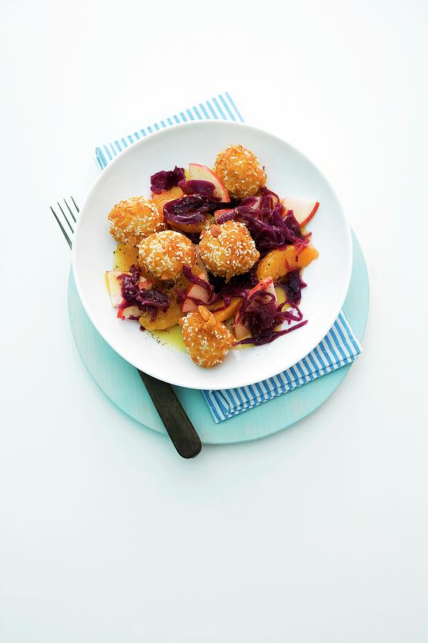 Sesame Seed Dumplings With Apple Red Cabbage Photograph by Michael Wissing
