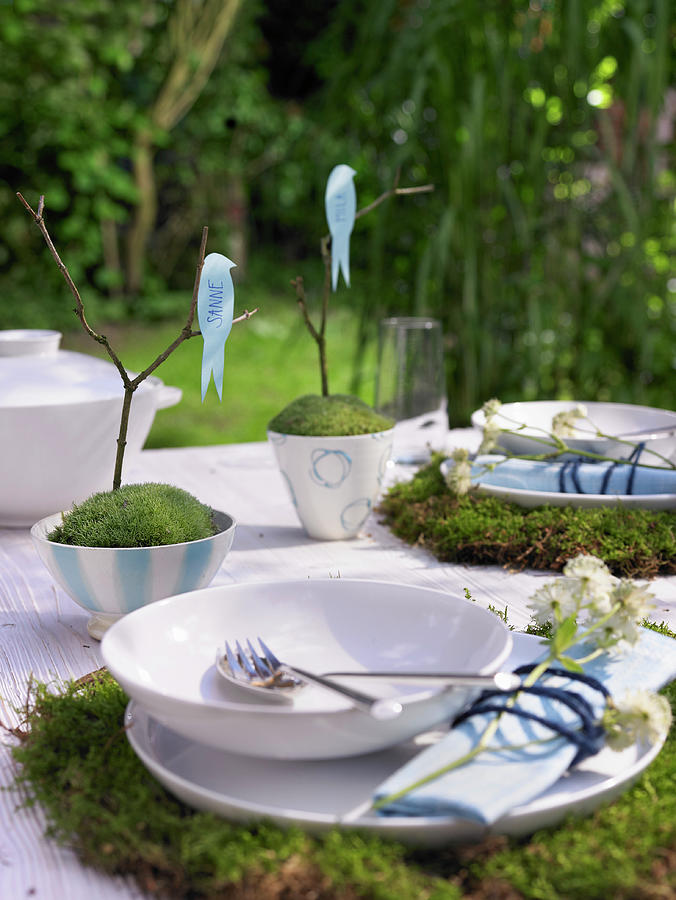 Set Table Decorated With Moss, Twigs And Bird Figurines Photograph by Viktor Wedel