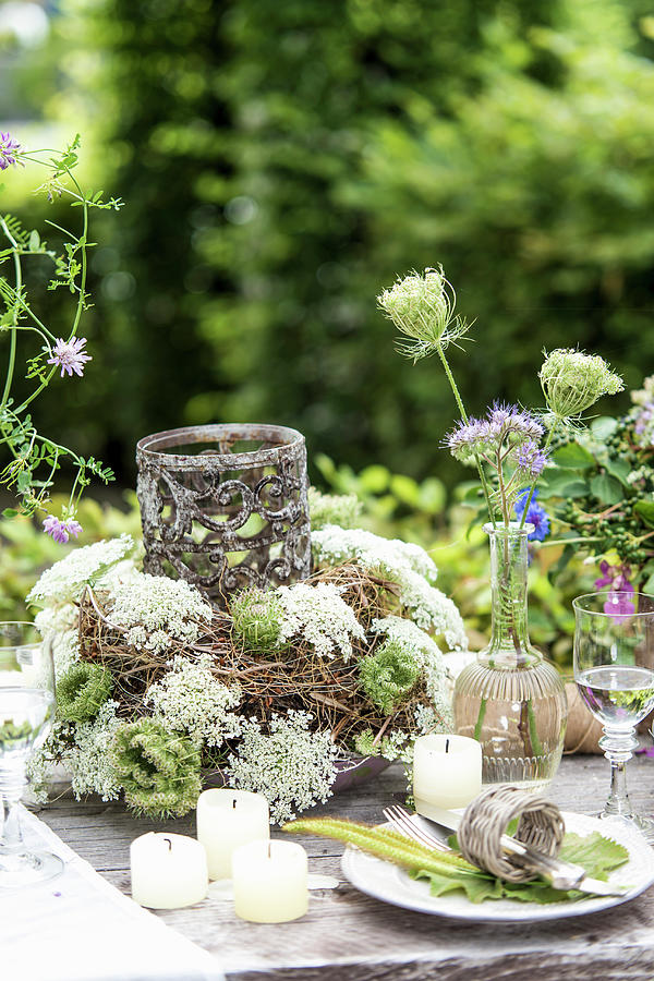 Set Table Decorated With Wildflowers In Garden Photograph by Bildhbsch