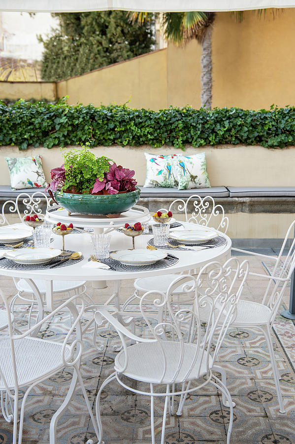 Set Table On Terrace Table With Ornate, White Metal Chairs Photograph by Francesca Pagliai