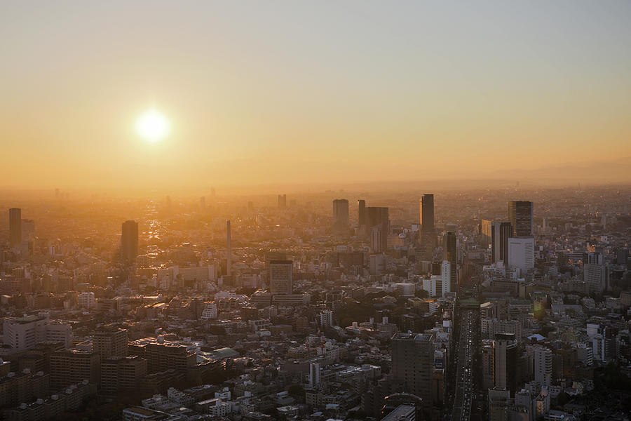 Setting Sun Above Tokyo Photograph by Alexey Kopytko