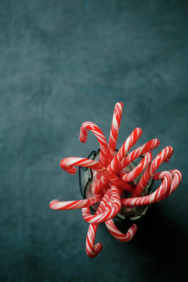 Several Candy Canes In A Container Photograph by Tracey Kusiewicz