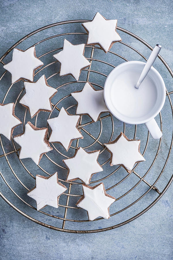 Several Cinnamon Stars And A Cup Of Eggnog On A Cooling Grill Photograph by Sylvia Meyborg