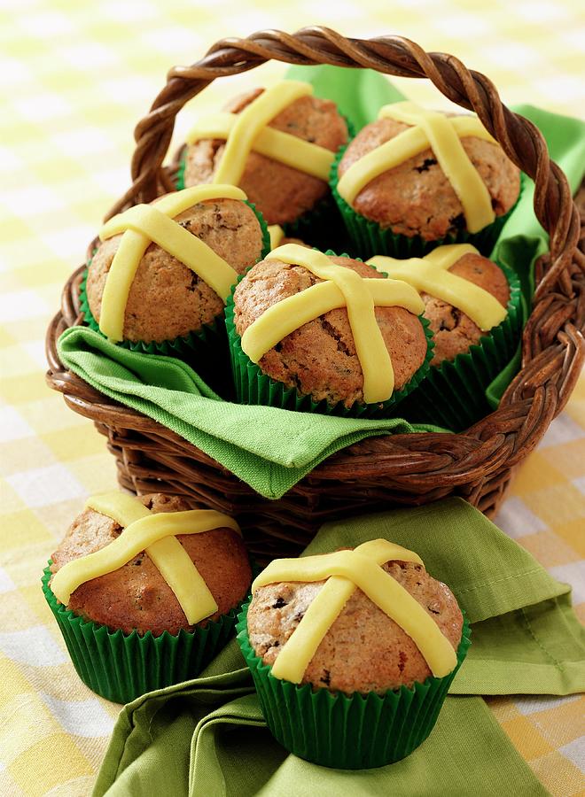 Several Easter Muffins With Marzipan Crosses In A Basket And On A Napkin Sitting On A Gingham Cloth Photograph by Stuart Macgregor