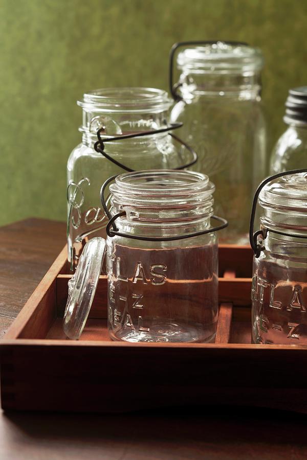 Several Empty Vintage Flip-top Preserving Jars In A Wooden Crate Photograph by Katharine Pollak