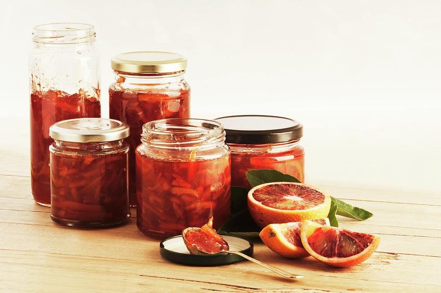 Several Jars Of Blood Orange & Campari Marmalade Photograph by John Hay