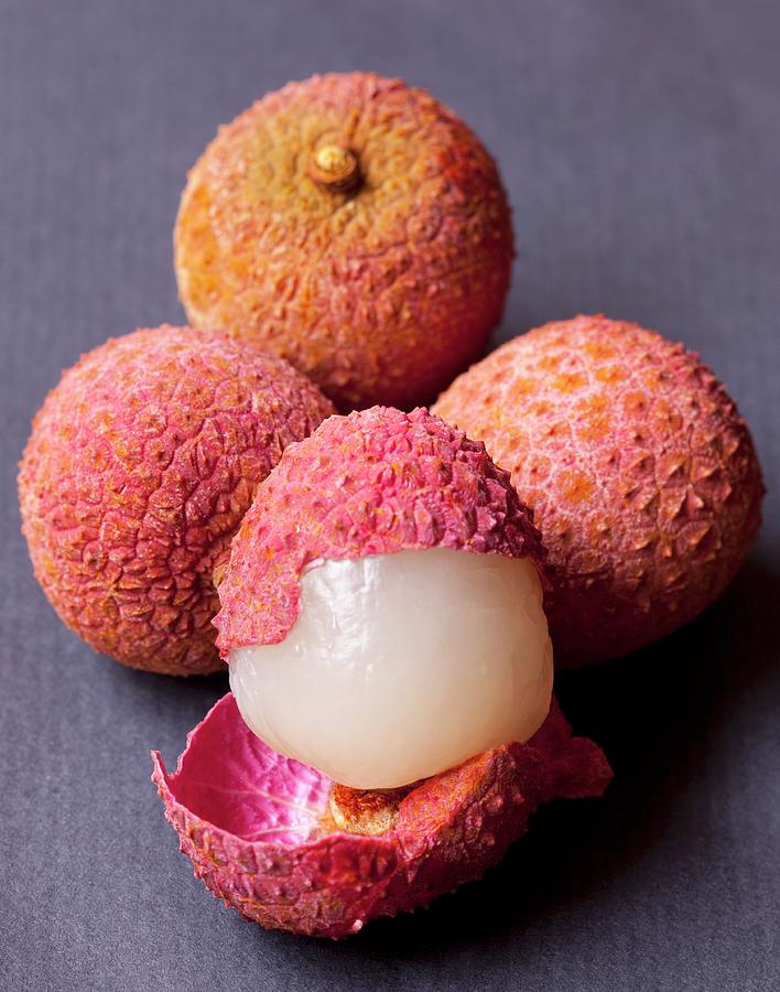 Several Lychees, Some Whole And Some Cut Open Photograph by Hilde Mche