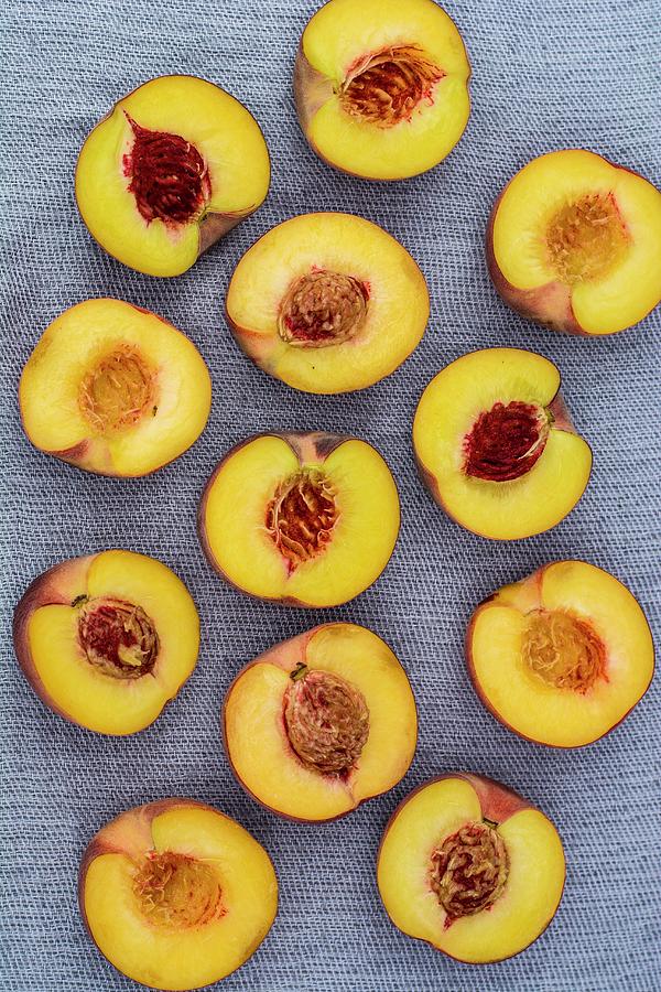 Several Nectarine Halves seen From Above Photograph by Leah Bethmann
