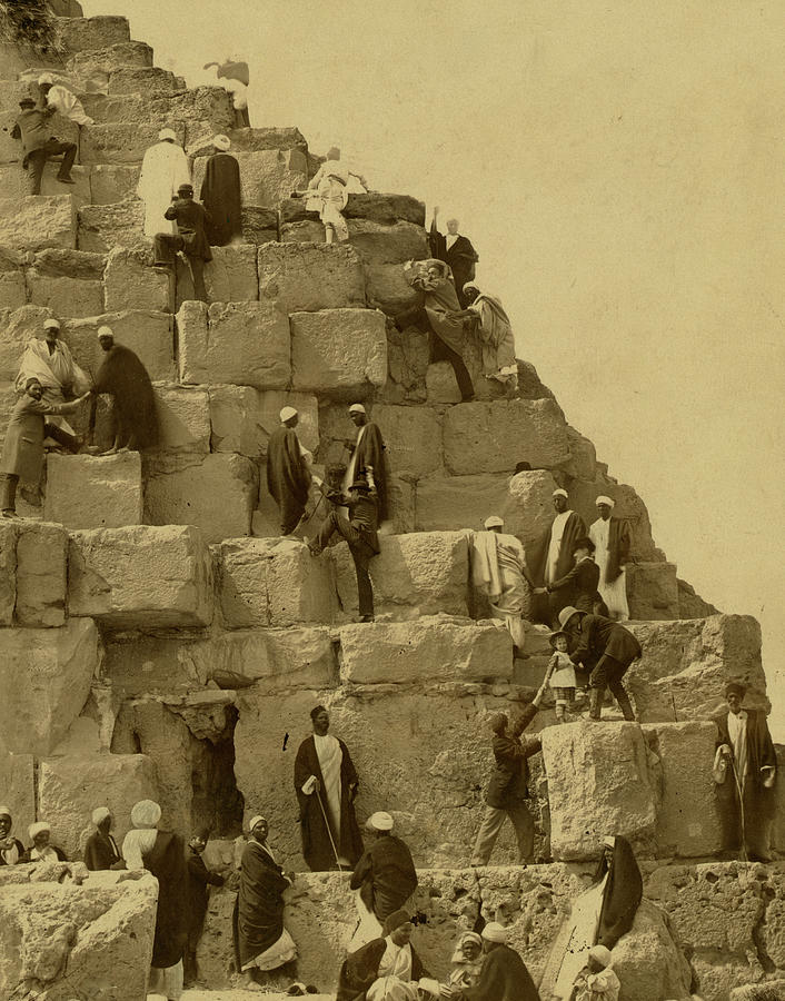 Several people gathered at the base of the Great Pyramid, others climbing Painting by 