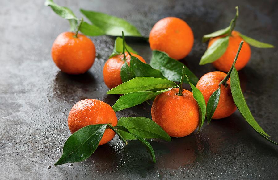 Several Tangerines With Leaves Photograph by Ewgenija Schall