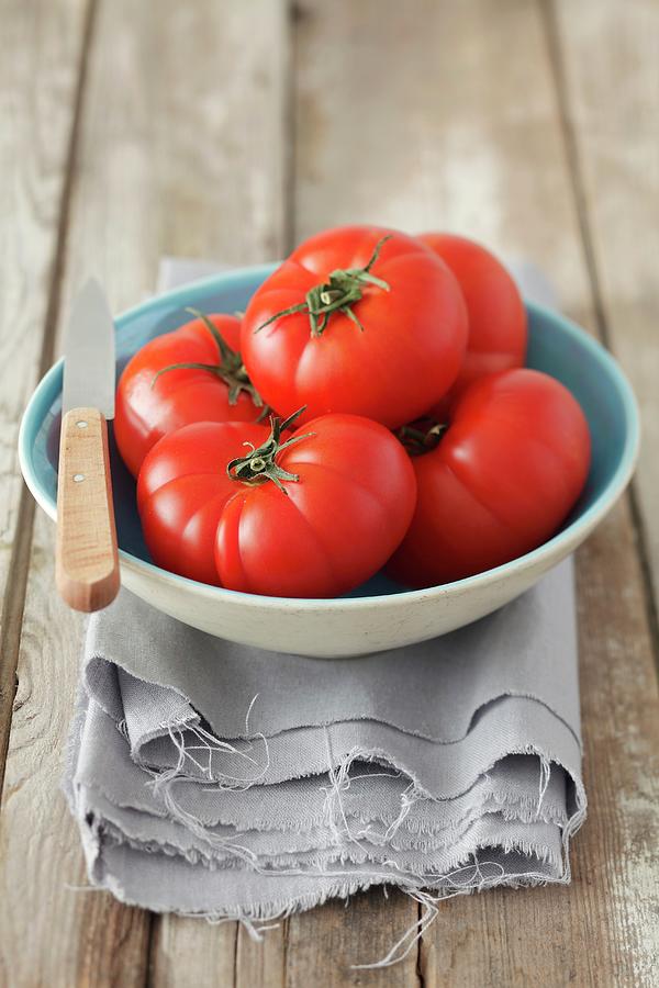 Several Tomatoes In A Bowl Photograph by Rua Castilho