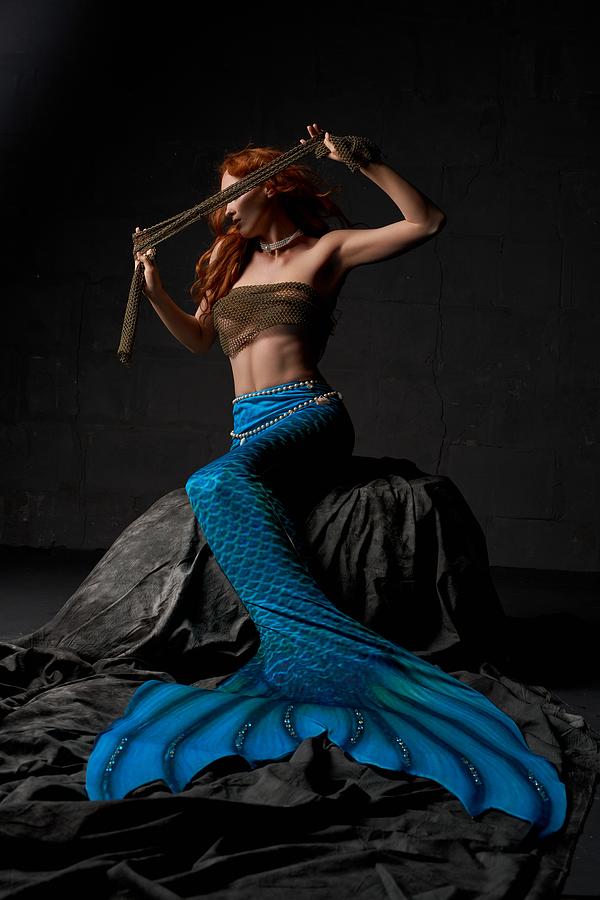Sexy Redhead Mermaid With Blue Tail And Boobs Wrapped In Net Cloth Hiding Eyes Photograph by Andrey Guryanov
