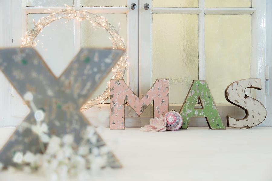 Shabby-chic Ornamental Letters Spelling Xmas In Front Of Window Photograph by Bildhbsch