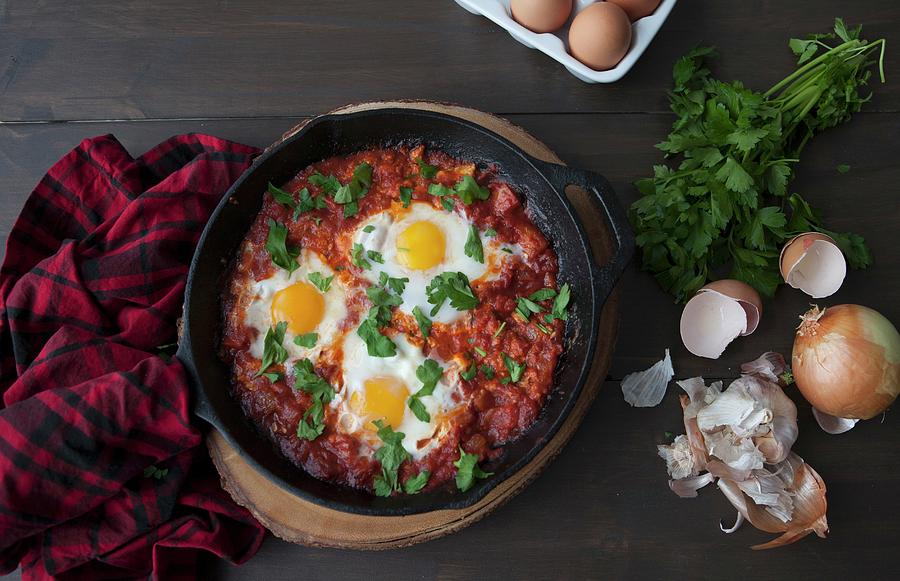 Shakshuka poached Eggs In Tomato Sauce, North Africa Photograph by Debra Cowie