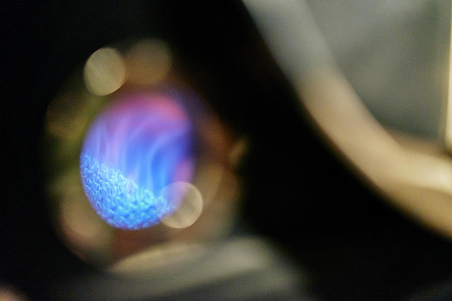Coffee Digital Art - Shallow Focus Close Up Of Blue Gas Flame Roasting Coffee In Coffee Shop by Gs Visuals