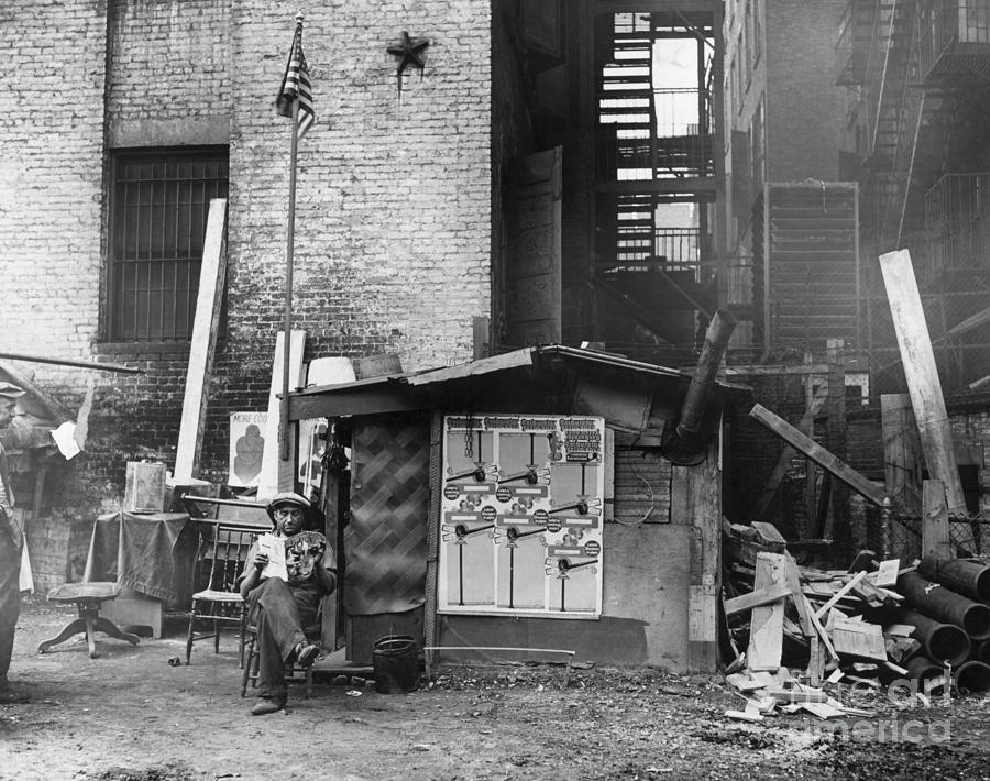 Shanty Home With Flag Pole by Bettmann