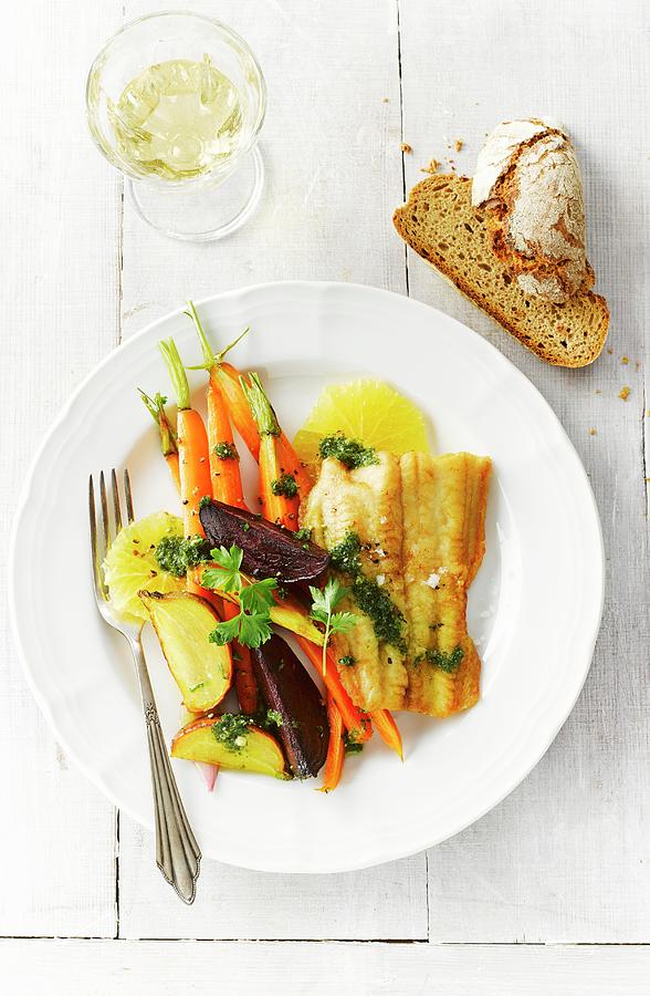 Sheatfish With Beetroot, Yellow Beets, Carrots, Herbs, Oranges And Pesto Photograph by Kai Schwabe
