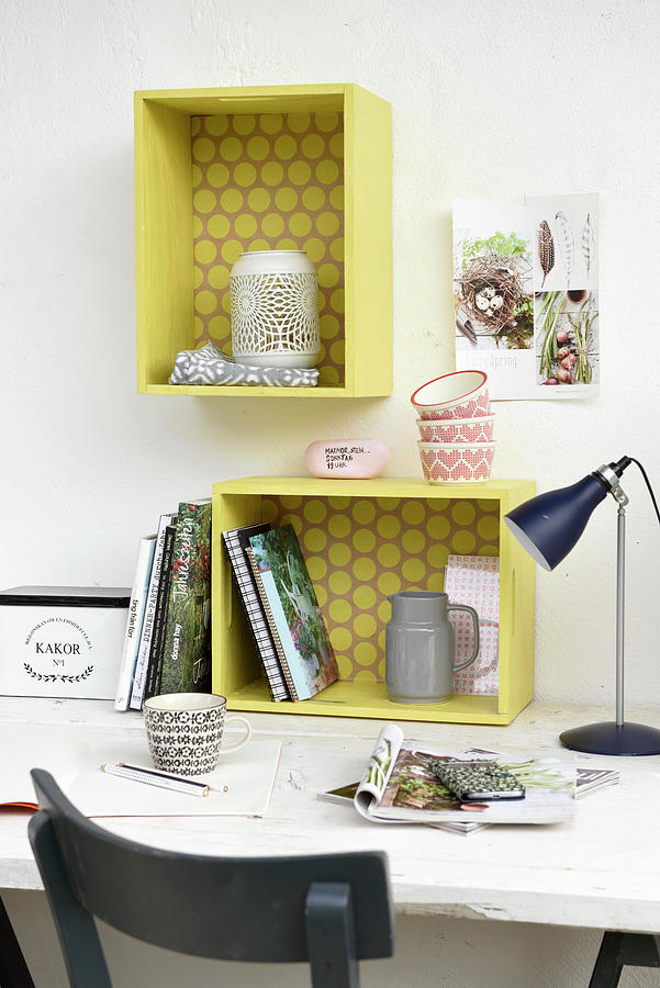 Shelf Modules Made From Wooden Crates Painted Yellow Above Desk Photograph by Flowers & Green