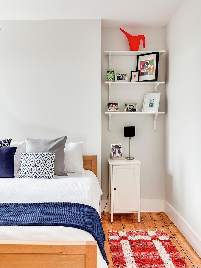 Shelves And Bedside Cabinet In Niche Next To Bed Photograph by Simon Maxwell Photography