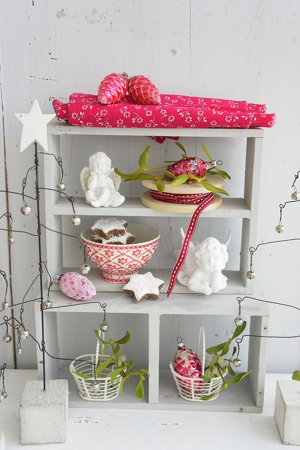 Shelves Festively Decorated With Angels. Biscuits, Glass Ornaments And Mistletoe Photograph by Martina Schindler