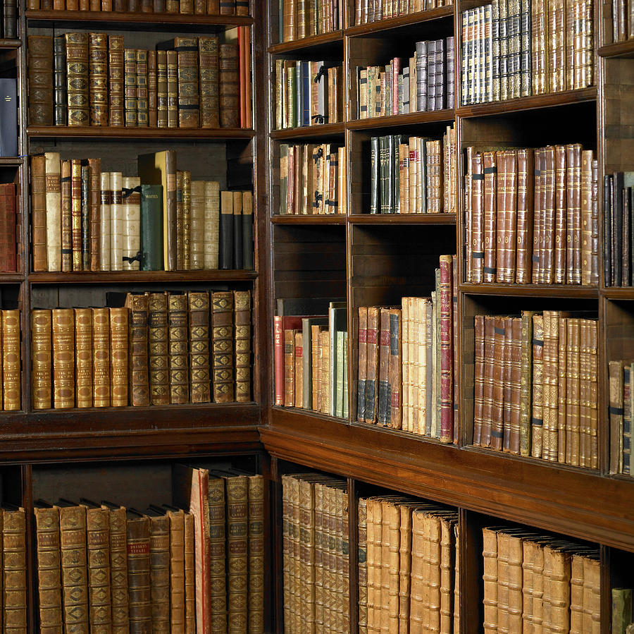 Shelves Of Old Books In Library Photograph by Dougal Waters