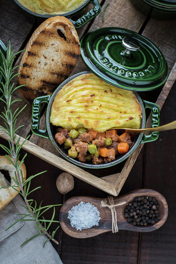Shepherds Pie In A Small Cocotte With Dark Beer And Bread Photograph by Christian Kutschka