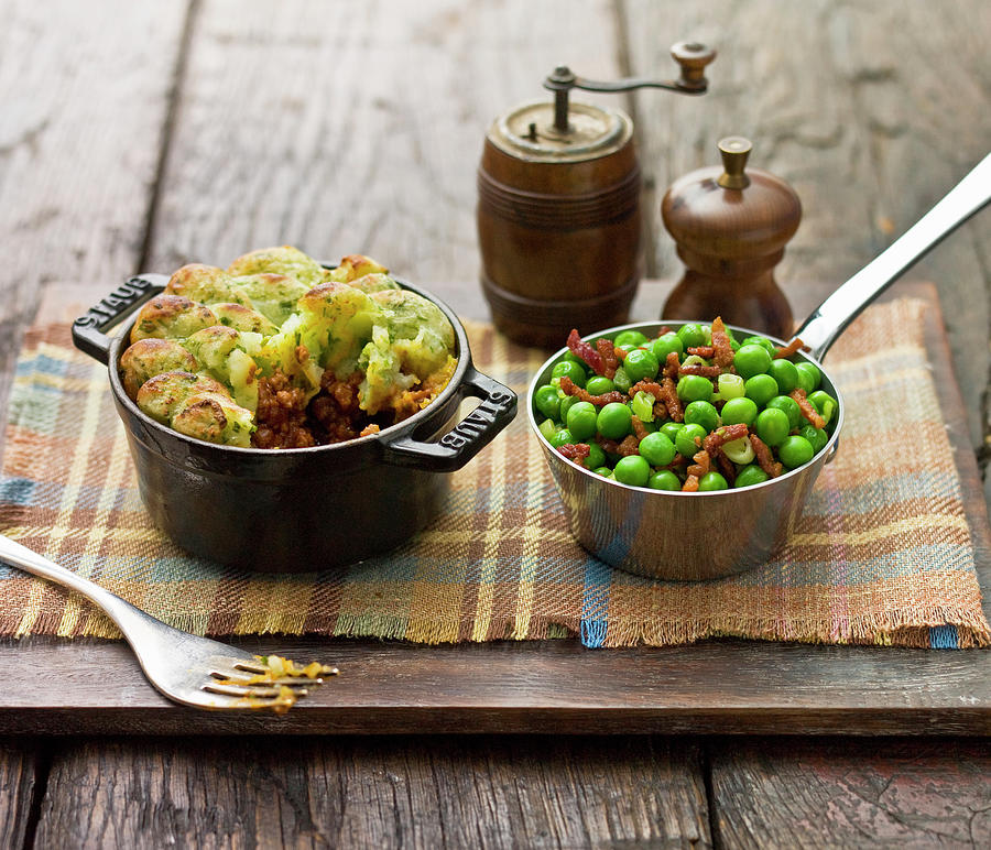 Shepherds Pie, With A Piped Mash Potato Topping And Garden Peas With Bacon Bits Photograph by Clive Sherlock