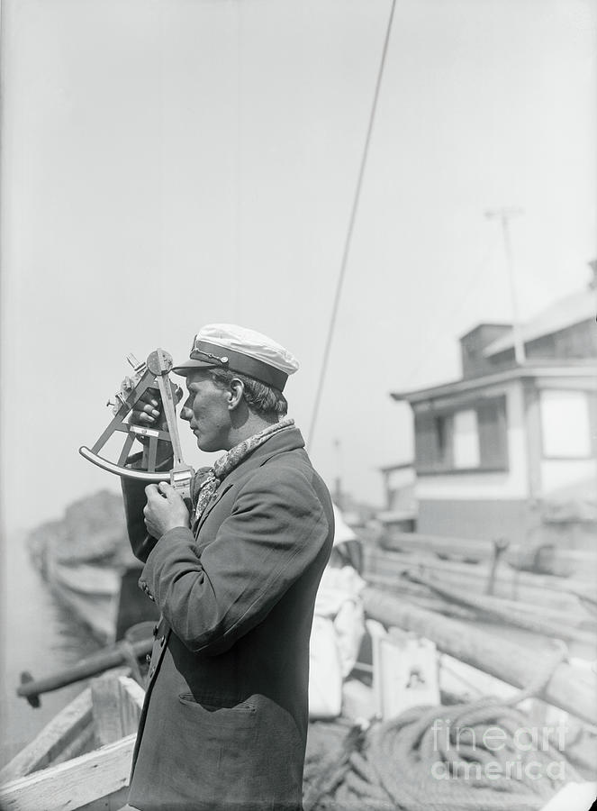 Ship Pilot Using Old Sextant Photograph by Bettmann