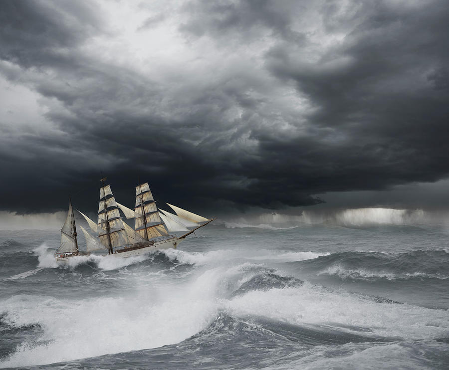 sailboat in stormy seas