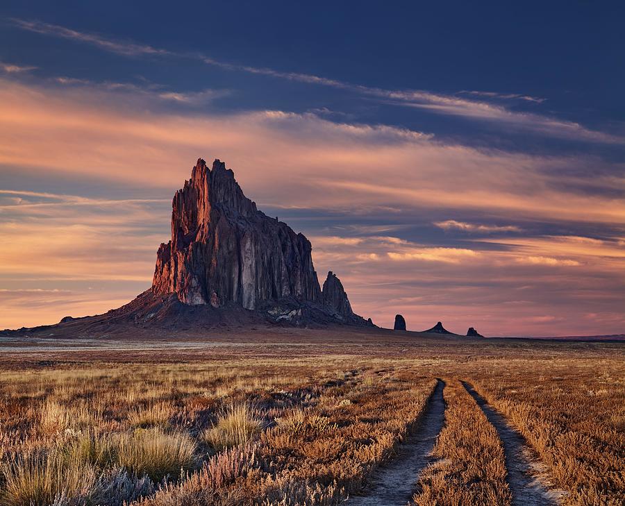 Sunset Photograph - Shiprock, The Great Volcanic Rock by DPK-Photo
