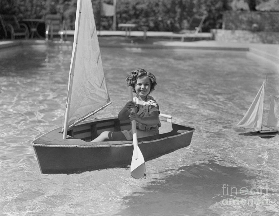 Shirley Temple In A Small Sailboat Photograph by Bettmann