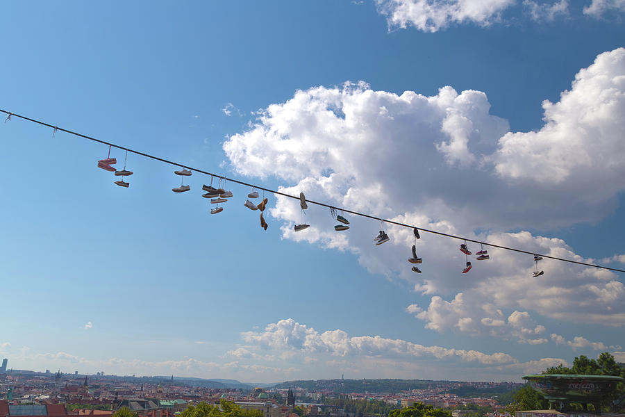 Shoes hanging over Prague Photograph by Vivida Photo PC