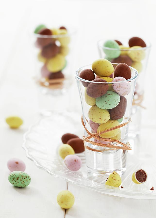 Shot Glasses Filled With Mini Chocolate Eggs Photograph by Jane Saunders