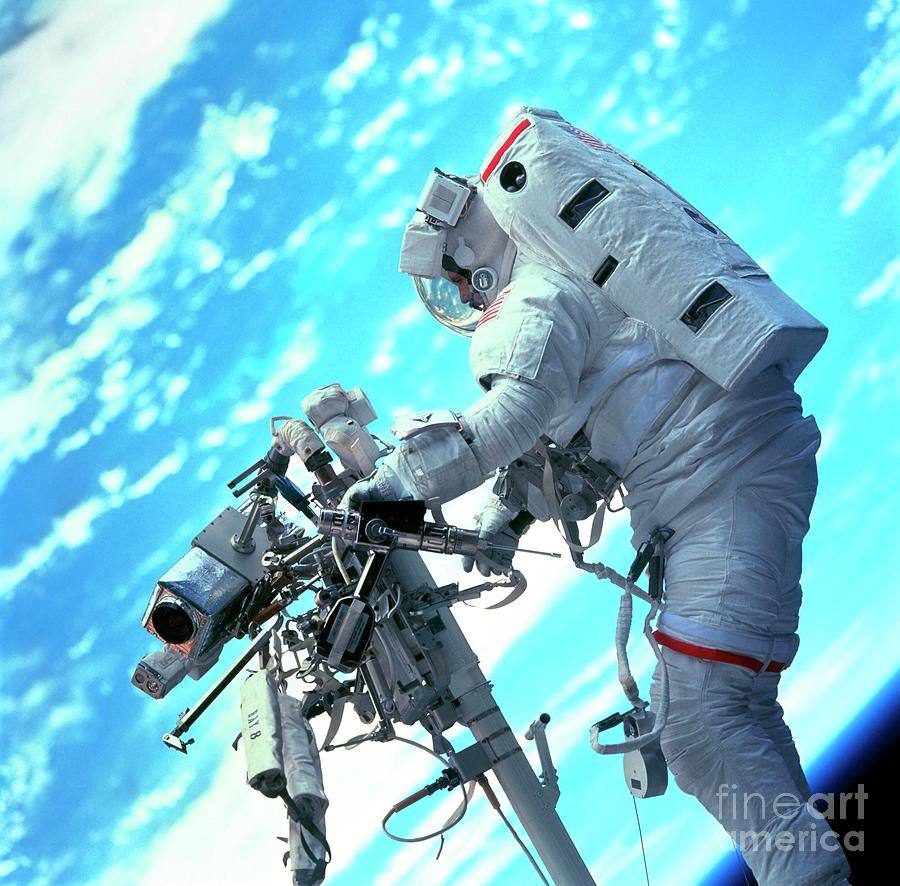 Shuttle Astronaut On Remote Manipulator Photograph by Nasa/science Photo Library