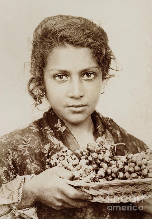 Sicilian girl with a bunch of grapes Photograph by Wilhelm Von Gloeden