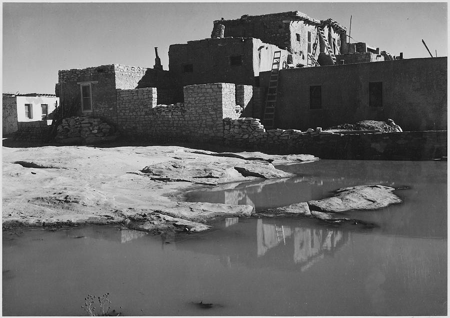 Side view of adobe house with water in foreground Acoma Pueblo [National Historic Landmark New Mexico]. 1933 - 1942 Painting by Ansel Adams