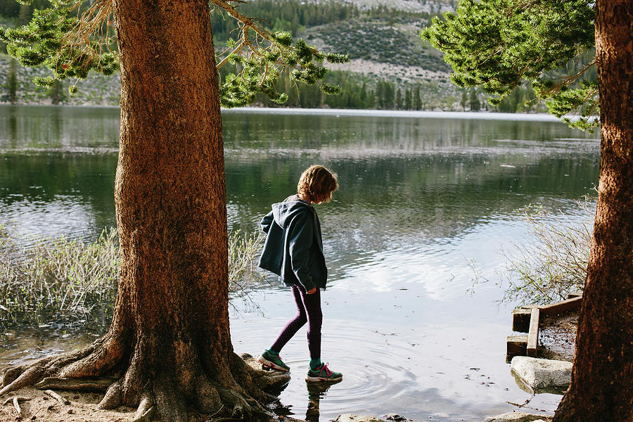 Nature Photograph - Side View Of Girl Standing In Lake At Inyo National Forest by Cavan Images
