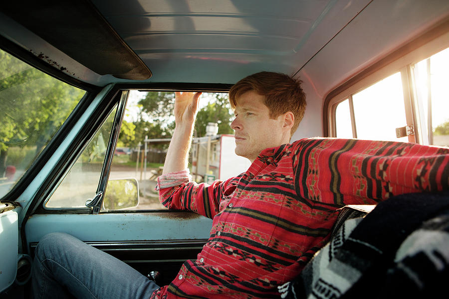 Side View Of Man Sitting In Pick-up Truck Photograph by Cavan Images ...