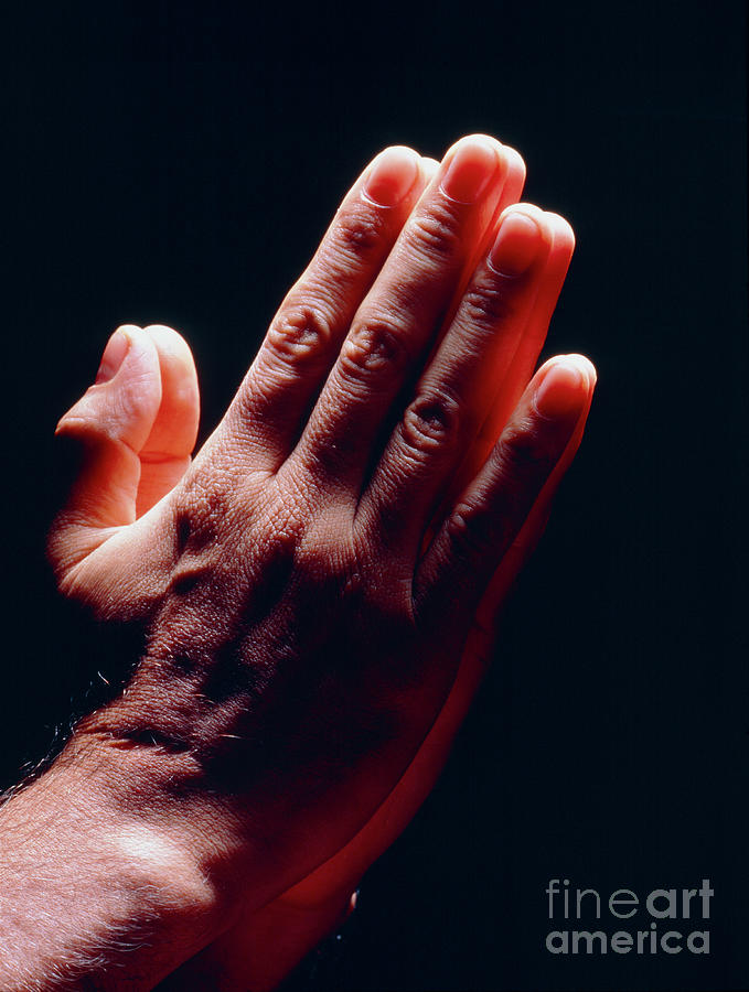 Side View Of Mans Hands Held Together In Prayer Photograph by Oscar Burriel/science Photo Library
