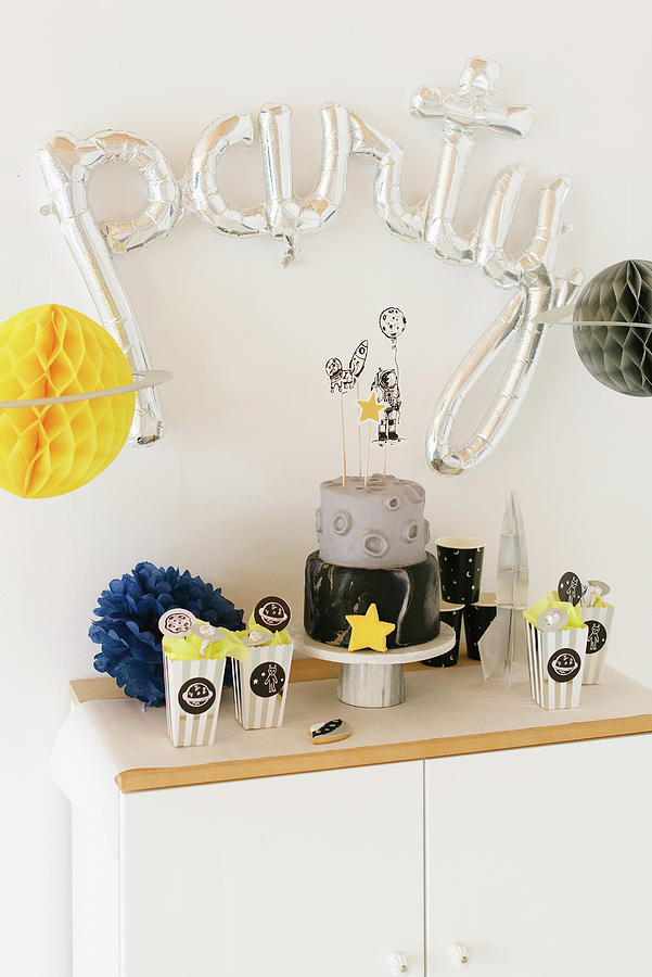 Sideboard Decorated With Space-themed Birthday Party Photograph by Katja Heil
