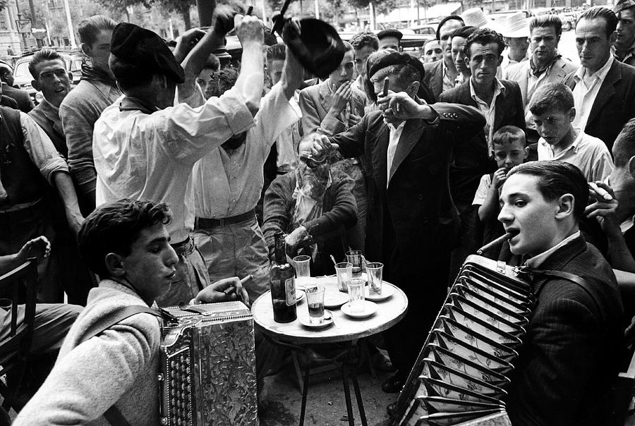 Black And White Photograph - Sidewalk Cafe During The Festival Of San Fermin by Tony Linck