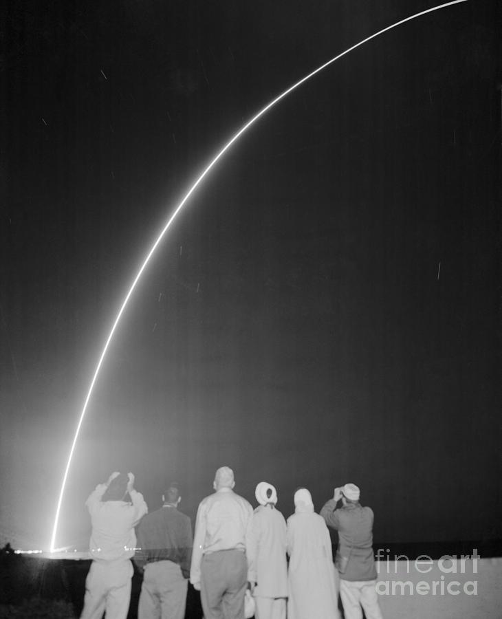 Sightseers Gazing At Missile Launch Photograph by Bettmann