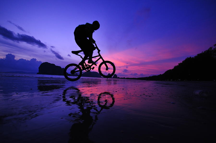 Silhouette Of A Mountain Biker On Beach Photograph by Primeimages