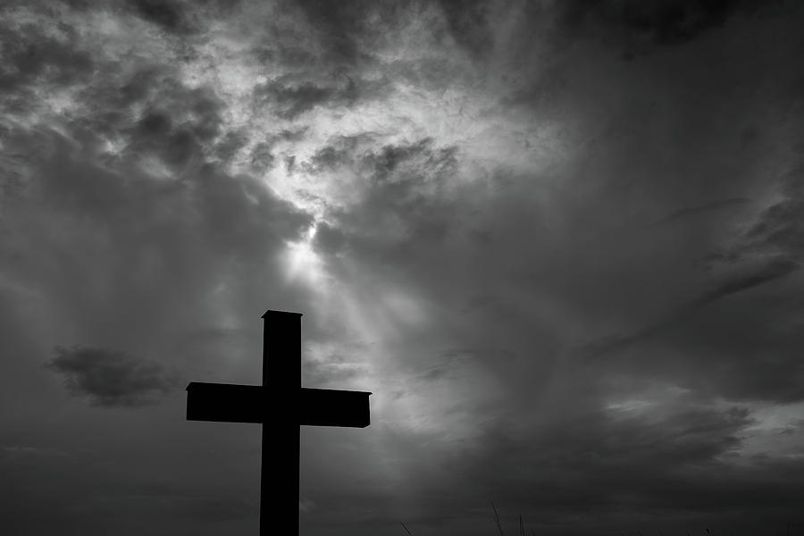 Silhouette of a simple catholic cross, dramatic stormclouds Photograph ...