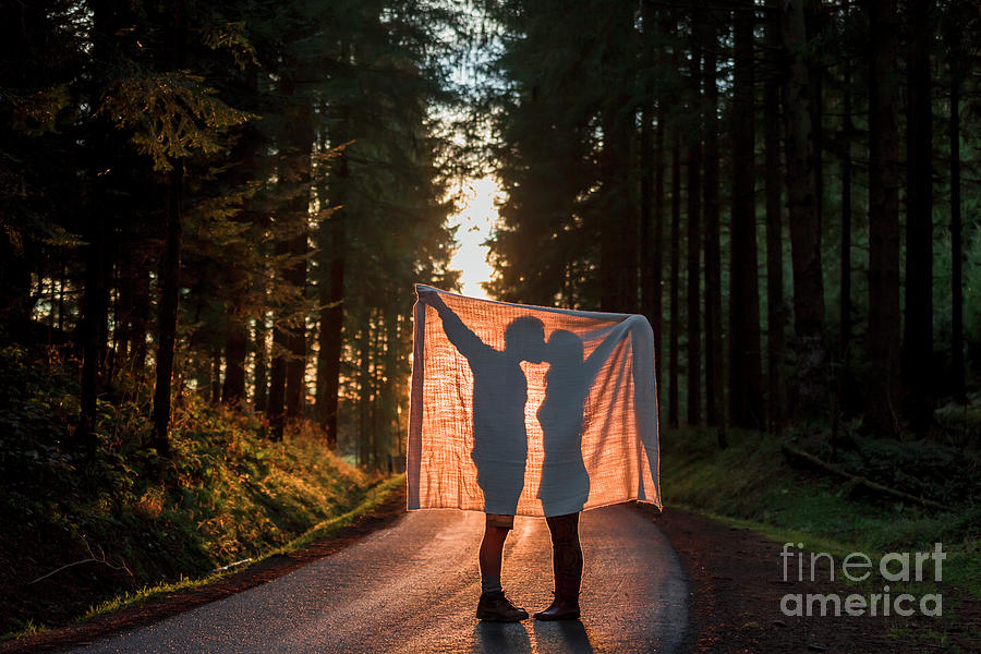 Silhouette Of Couple Holding Blanket Photograph by Westend61