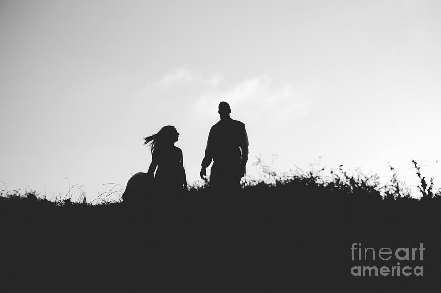 Silhouette of couple in love with wedding couple on top of a hil Photograph by Joaquin Corbalan