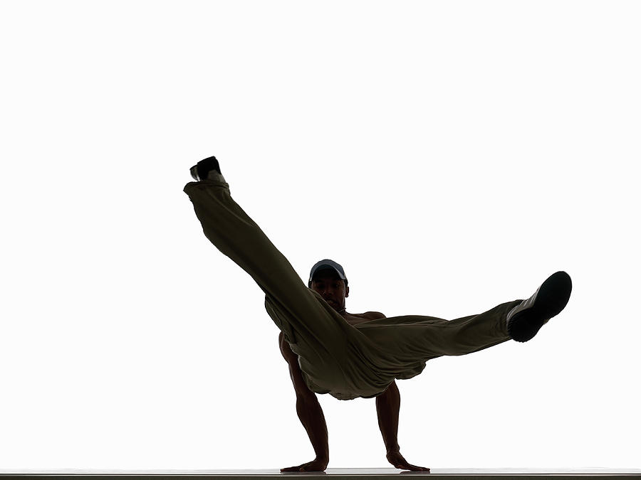 Silhouette Of Male Breakdancer Photograph by John Lamb