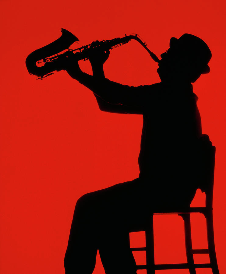 Silhouette Of Man Playing Saxophone Photograph by Grant Faint