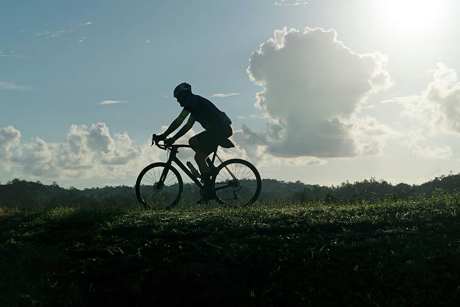 Silhouette Of Man Riding Bicycle Digital Art by Gabriel Jaime Jimenez
